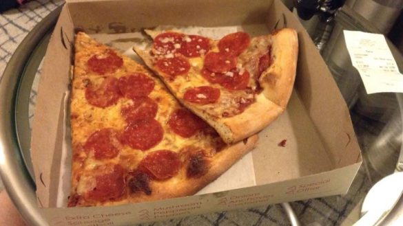 two slices of pizza in a box