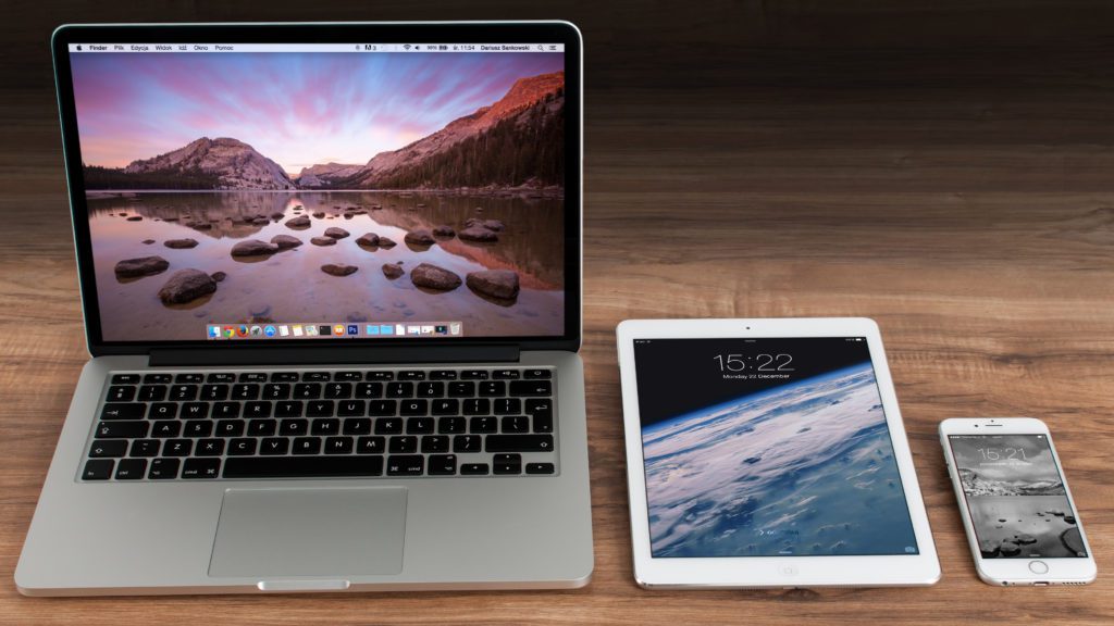 a laptop and tablet on a table