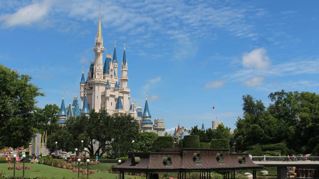 a castle with blue towers and a park