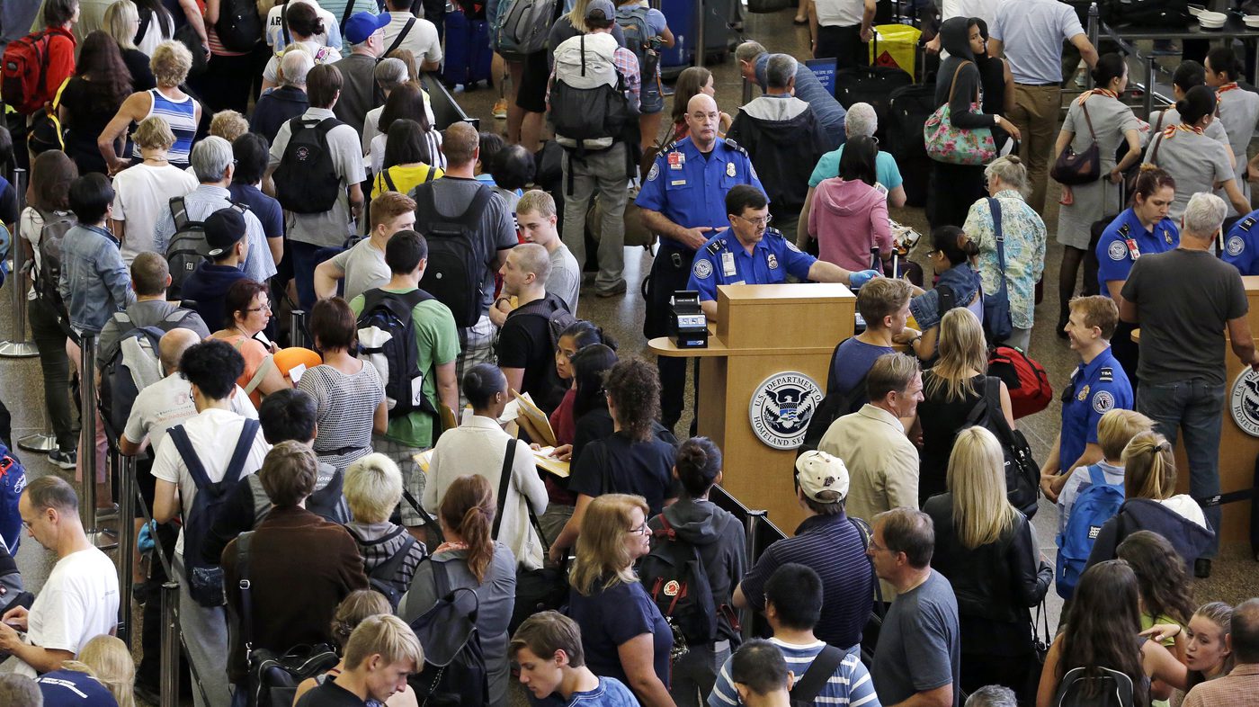 a crowd of people in an airport