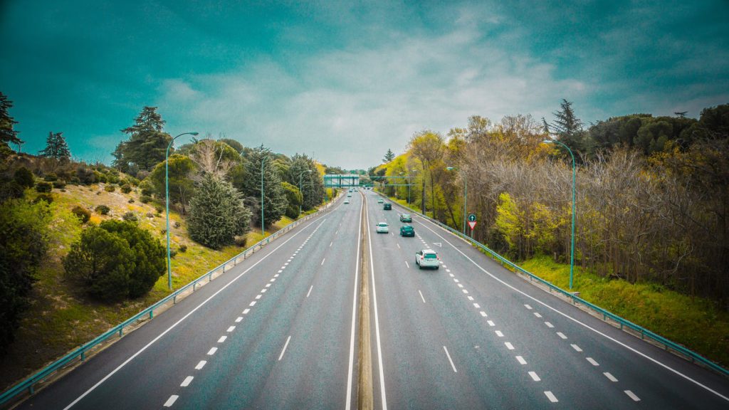 a highway with cars on it