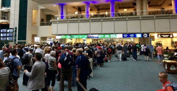 a crowd of people in an airport