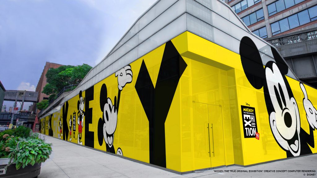 a building with yellow walls and cartoon characters on it