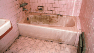 a dirty bathtub in a bathroom