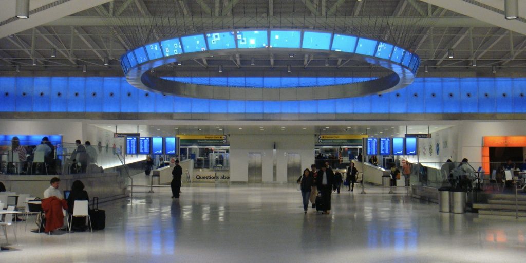 a group of people in an airport