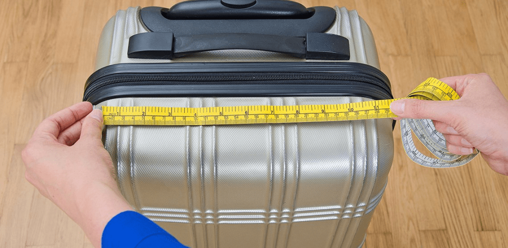 a suitcase with a measuring tape