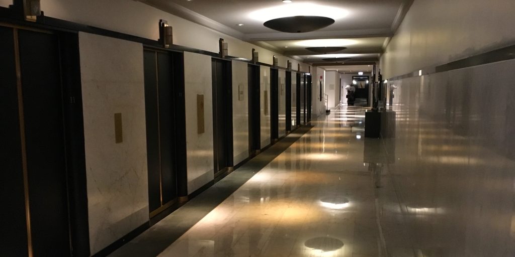 a hallway with doors and lights