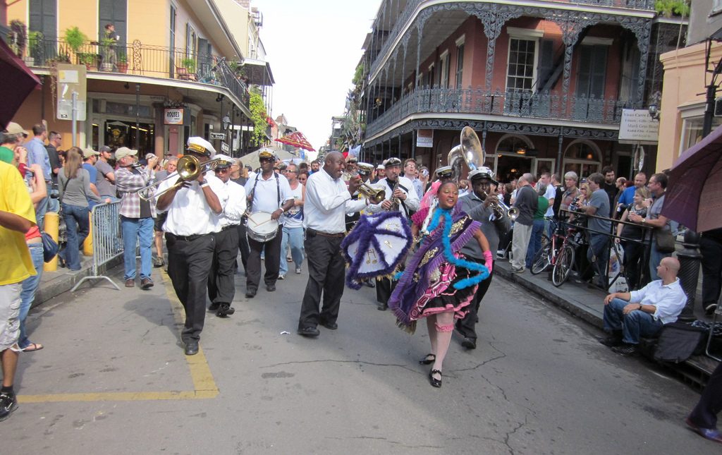 a group of people playing instruments in a street