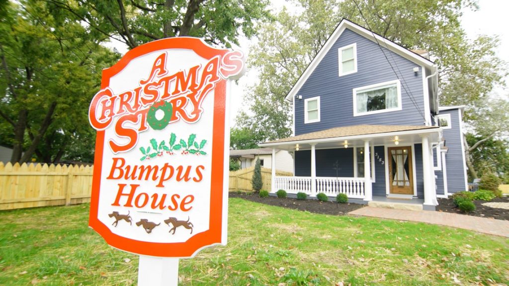 a house with a sign in front of it