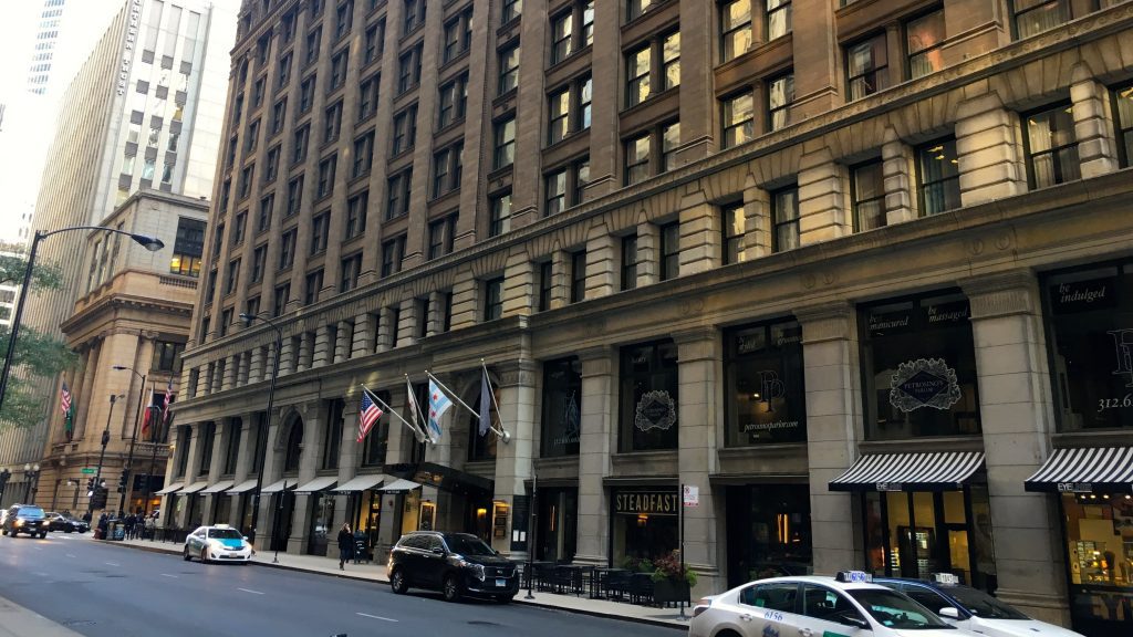 a building with flags on the front