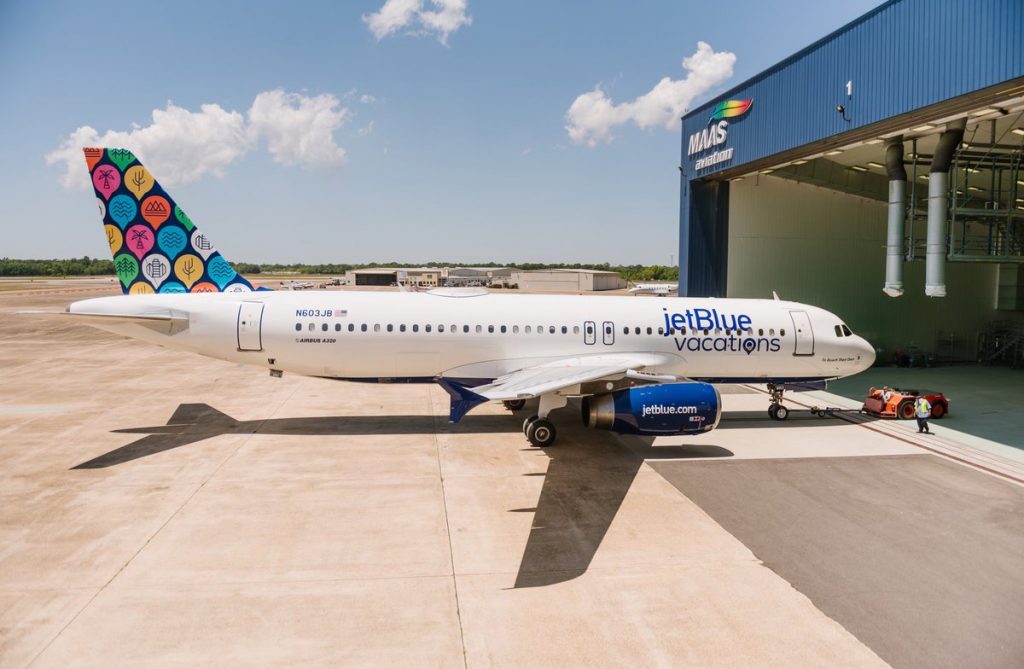 a jet plane parked at an airport