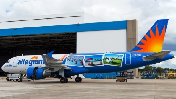 a blue airplane with images on it