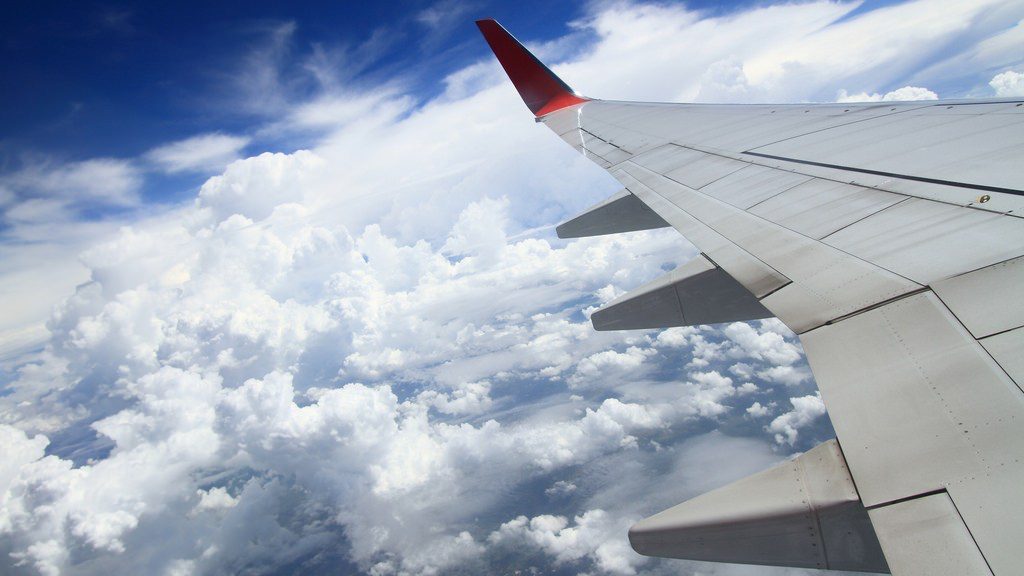 an airplane wing in the sky