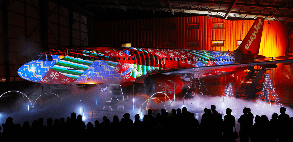 a large airplane with a colorful design on it