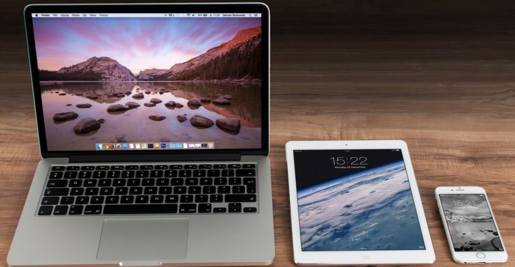 a laptop and tablet on a table