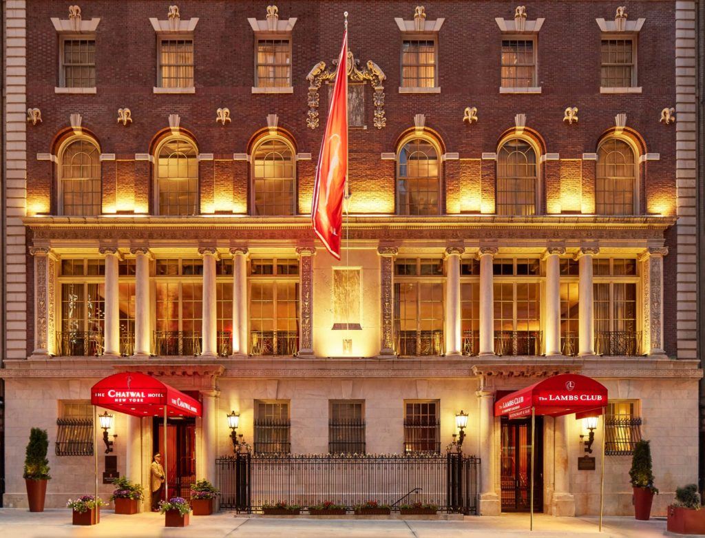 a building with a flag and a gate