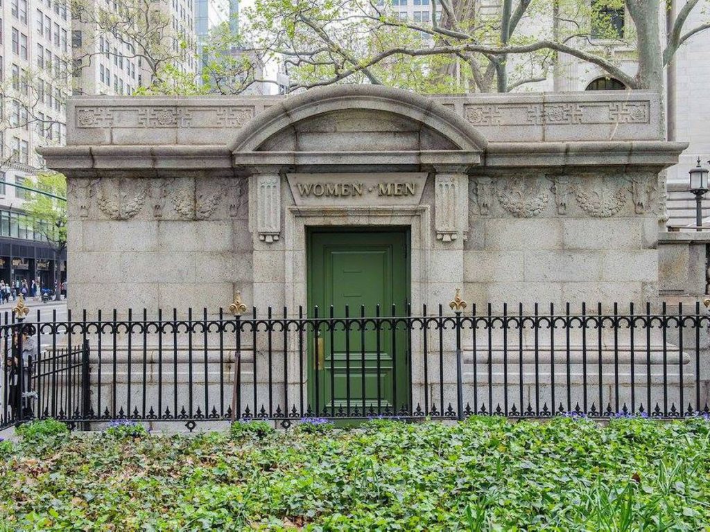 a stone building with a green door