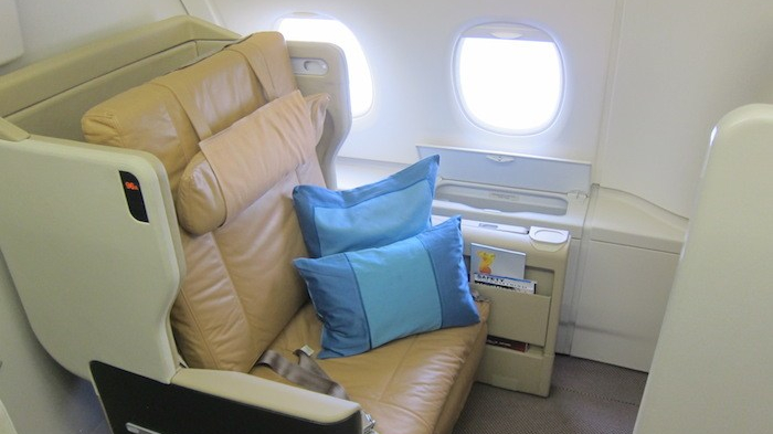 a seat with pillows on it