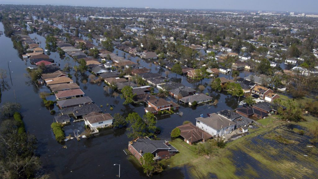 a flooded neighborhood with houses and trees