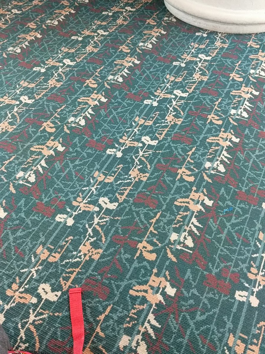 a carpet with a red strap