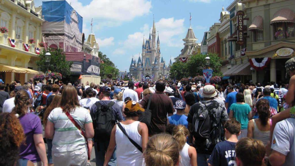 a crowd of people walking in a street