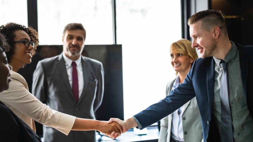 a man and woman shaking hands