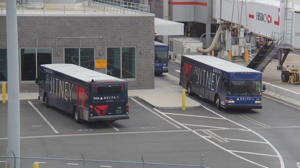 a group of buses parked in a parking lot