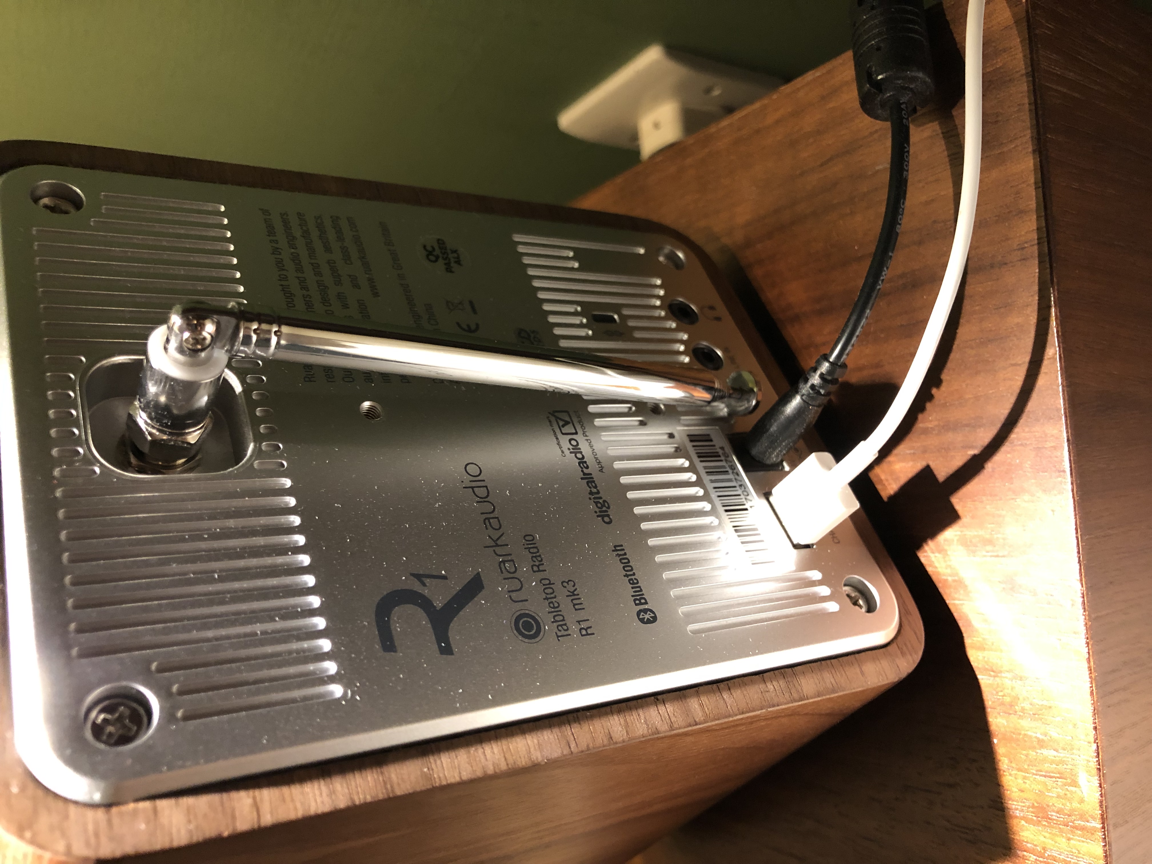 a rectangular box with a silver and black antenna