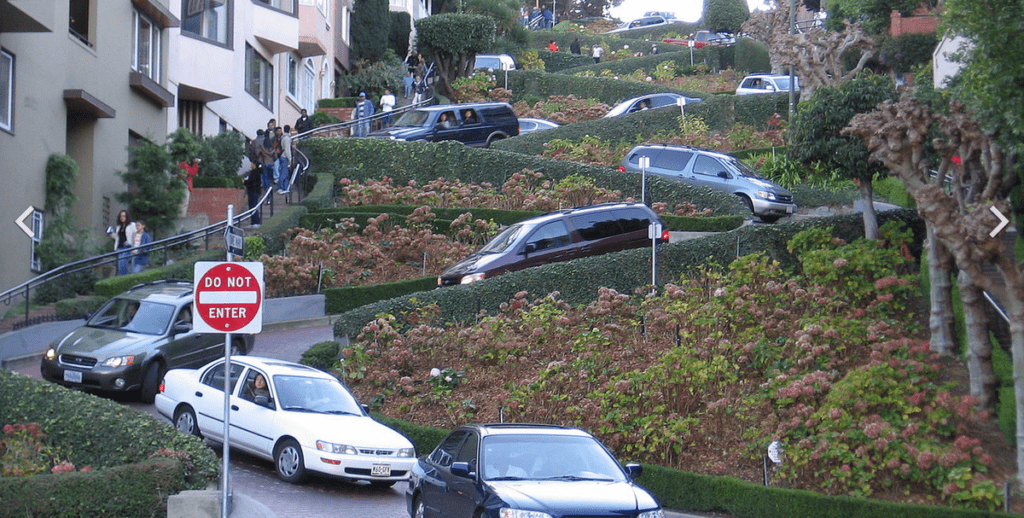 cars parked cars on a steep hill