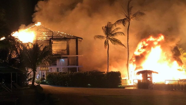 a house on fire at night