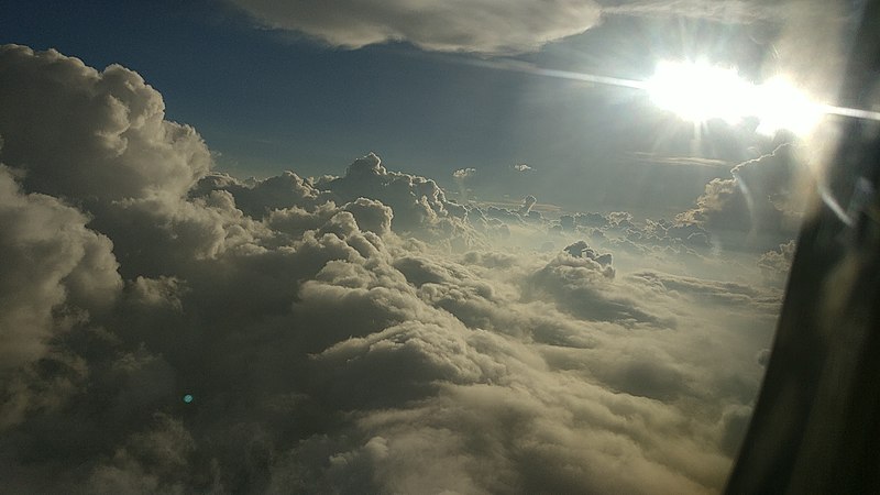 clouds and the sun above the clouds