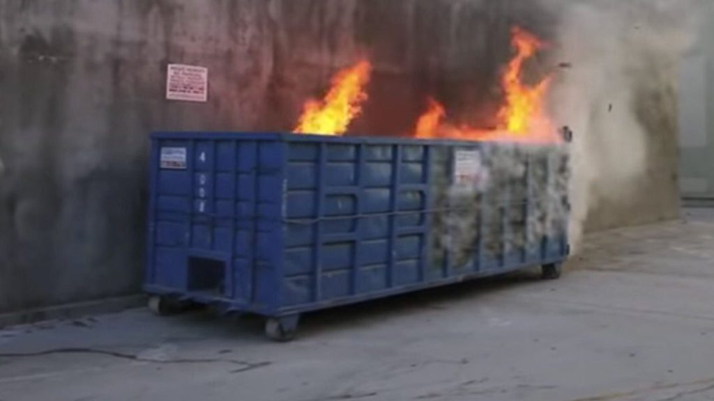 a blue container on fire