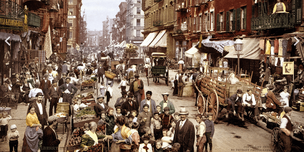 a group of people walking down a street