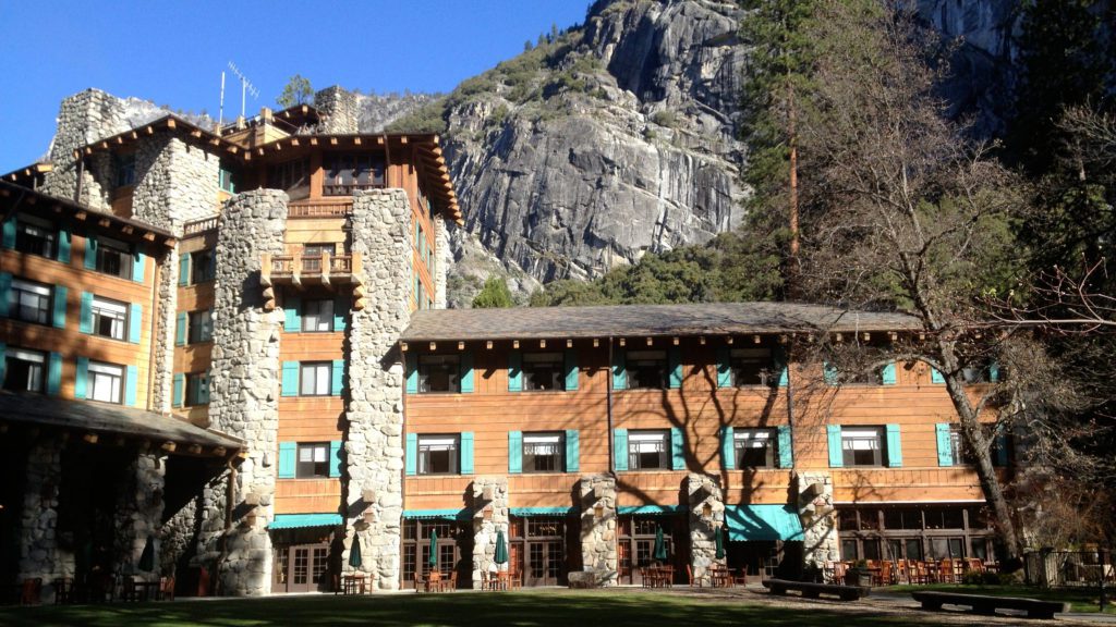 Ahwahnee Hotel with a mountain in the background