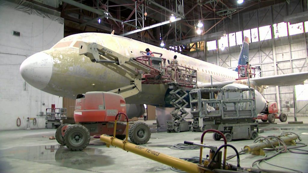 a large airplane in a hangar