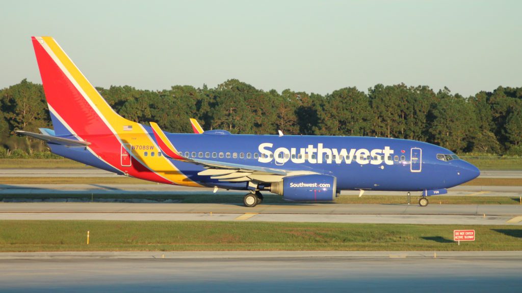 a colorful airplane on a runway