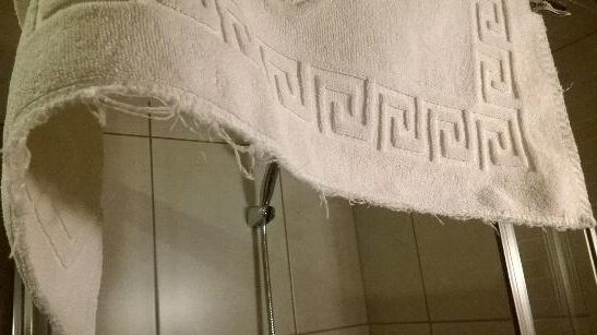 a white towel with a meander design