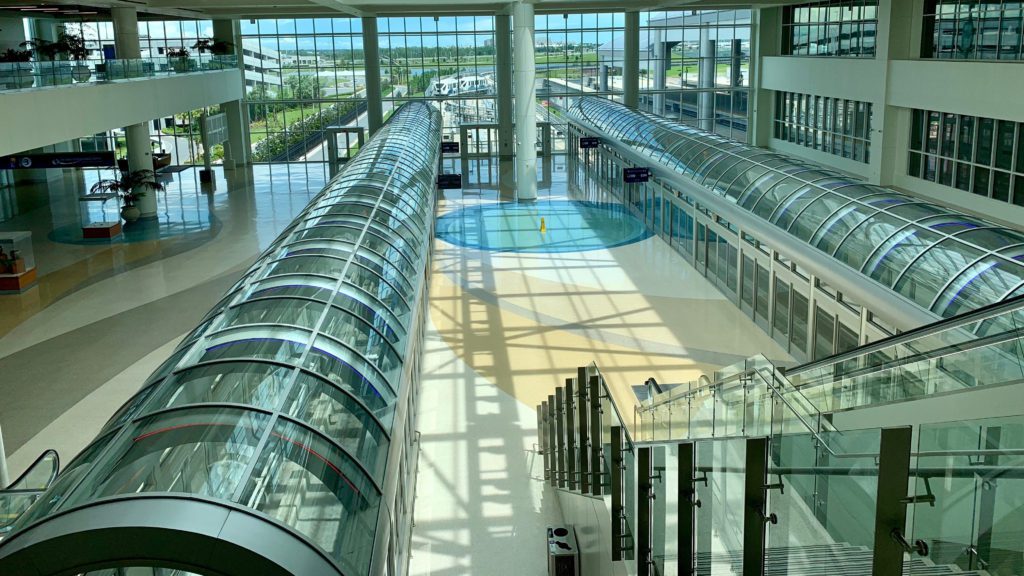 a large glass building with a circular walkway