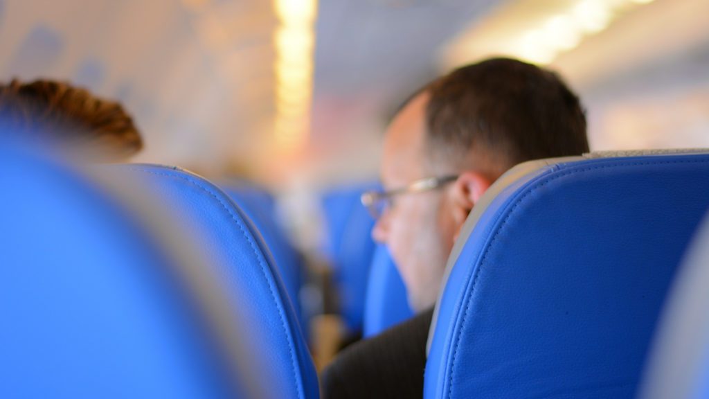 a man sitting in a plane