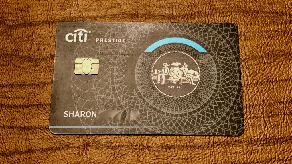 a credit card on a brown surface