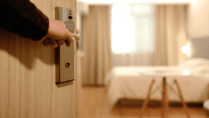 a hand holding a door handle