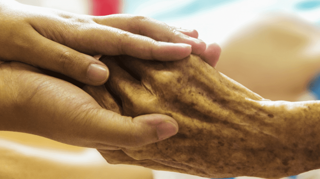 a close up of hands holding each other