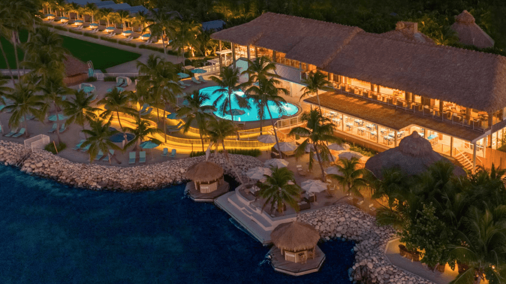 a resort with a pool and palm trees