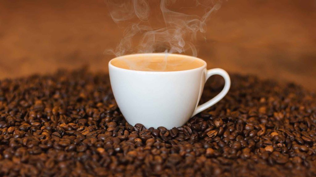 a cup of coffee with steam coming out of it