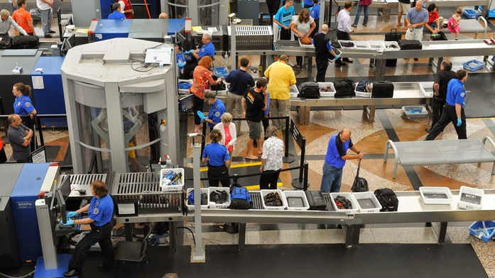 people at the airport check in counters