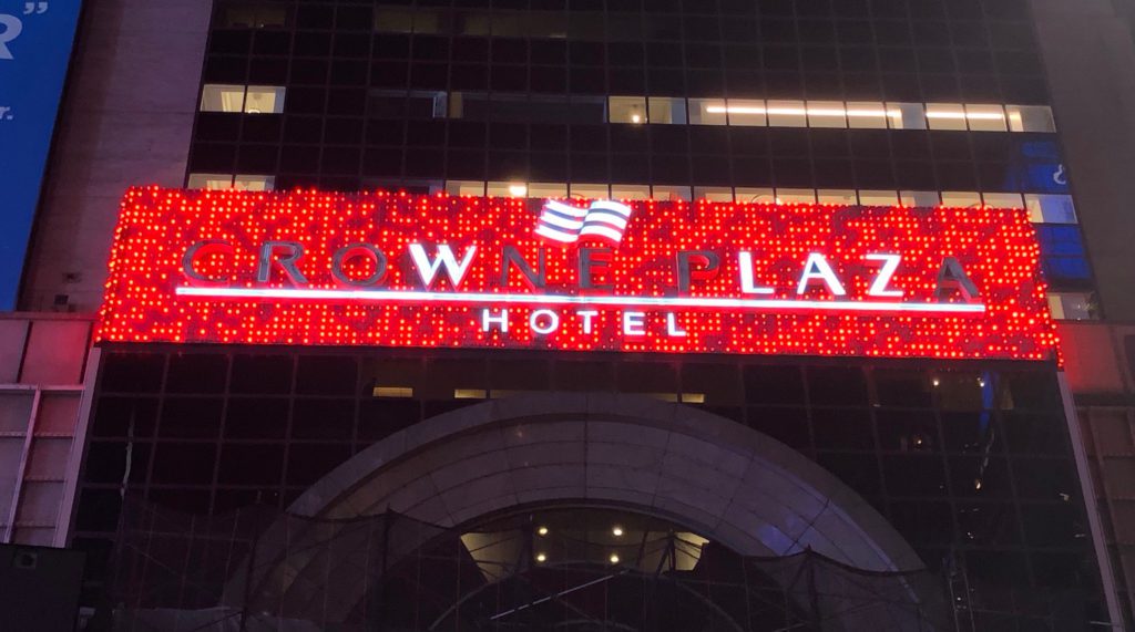 a lit up sign on a building