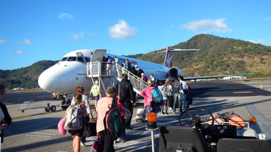 a group of people boarding an airplane