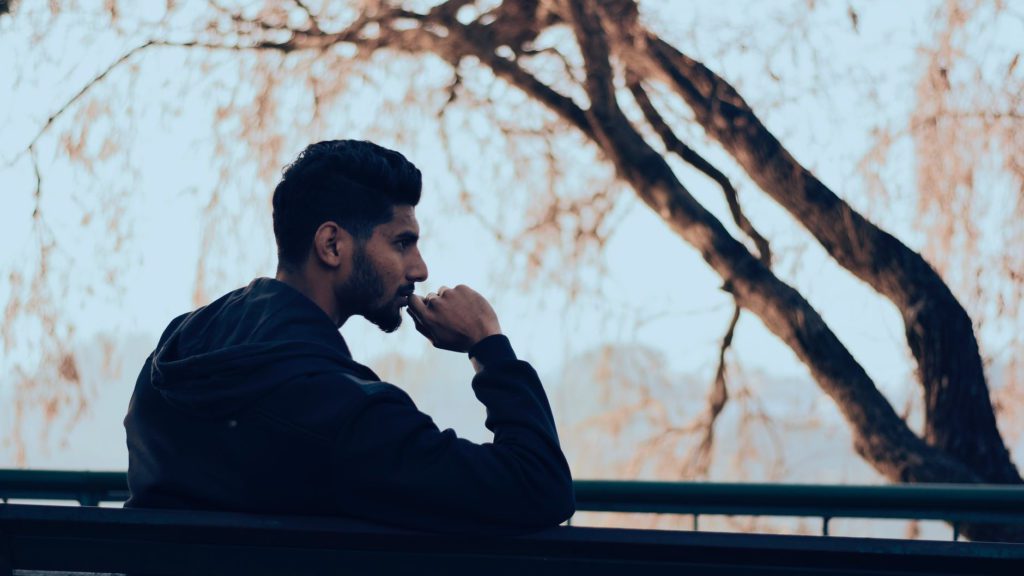 a man sitting on a bench