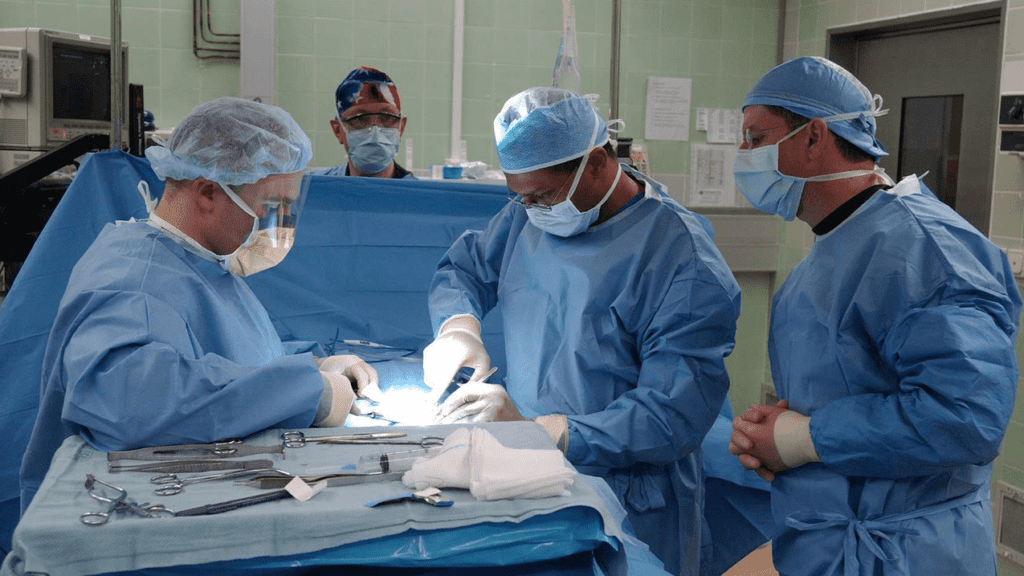 a group of surgeons performing surgery