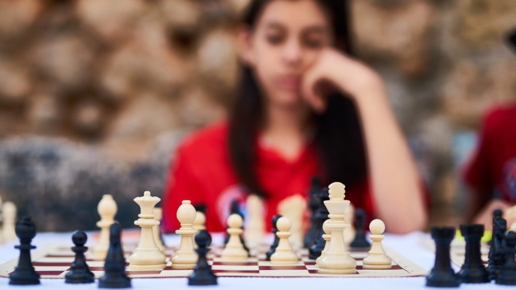 a girl playing chess